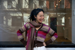 Atardecer Alpaca Scarf — striped alpaca knit in sunset hues, designed to match the Atardecer Cardigan, handmade in Bolivia.