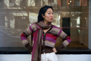 Atardecer Alpaca Scarf — striped alpaca knit in sunset hues, designed to match the Atardecer Cardigan, handmade in Bolivia.