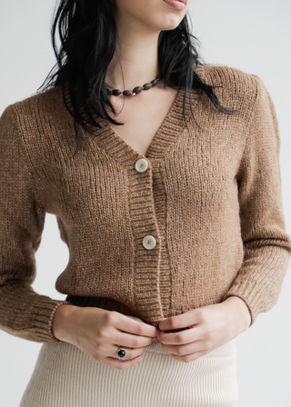 Aymarita Llama Cardigan — romantic cropped llama cardigan with delicate buttons, handmade in Bolivia, inspired by Aymara heritage.