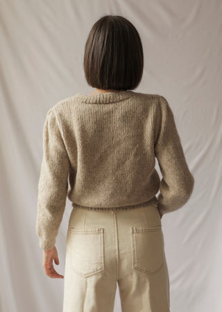 Aymarita Llama Cardigan — romantic cropped llama cardigan with delicate buttons, handmade in Bolivia, inspired by Aymara heritage.